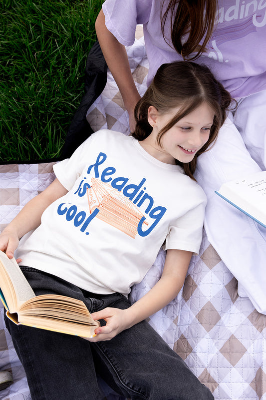 Reading is cool. on Youth Vintage White Short Sleeve Tee