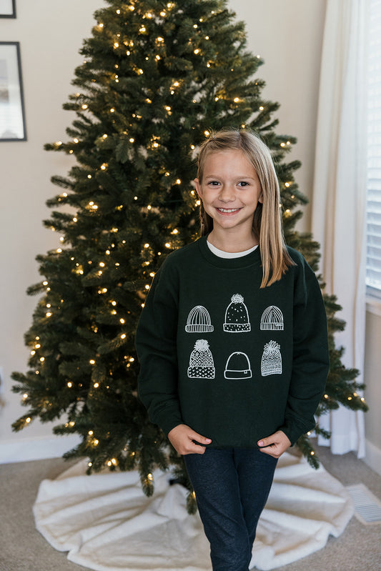 Kids Beanies on Green Sweater