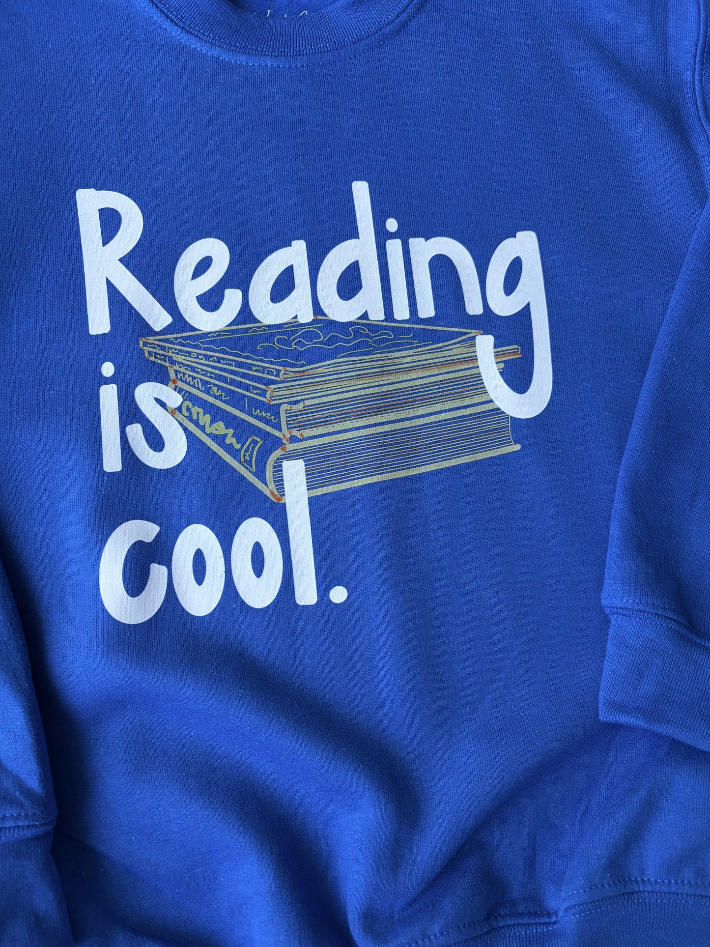 Reading is cool. on Youth Royal Blue Sweatshirt