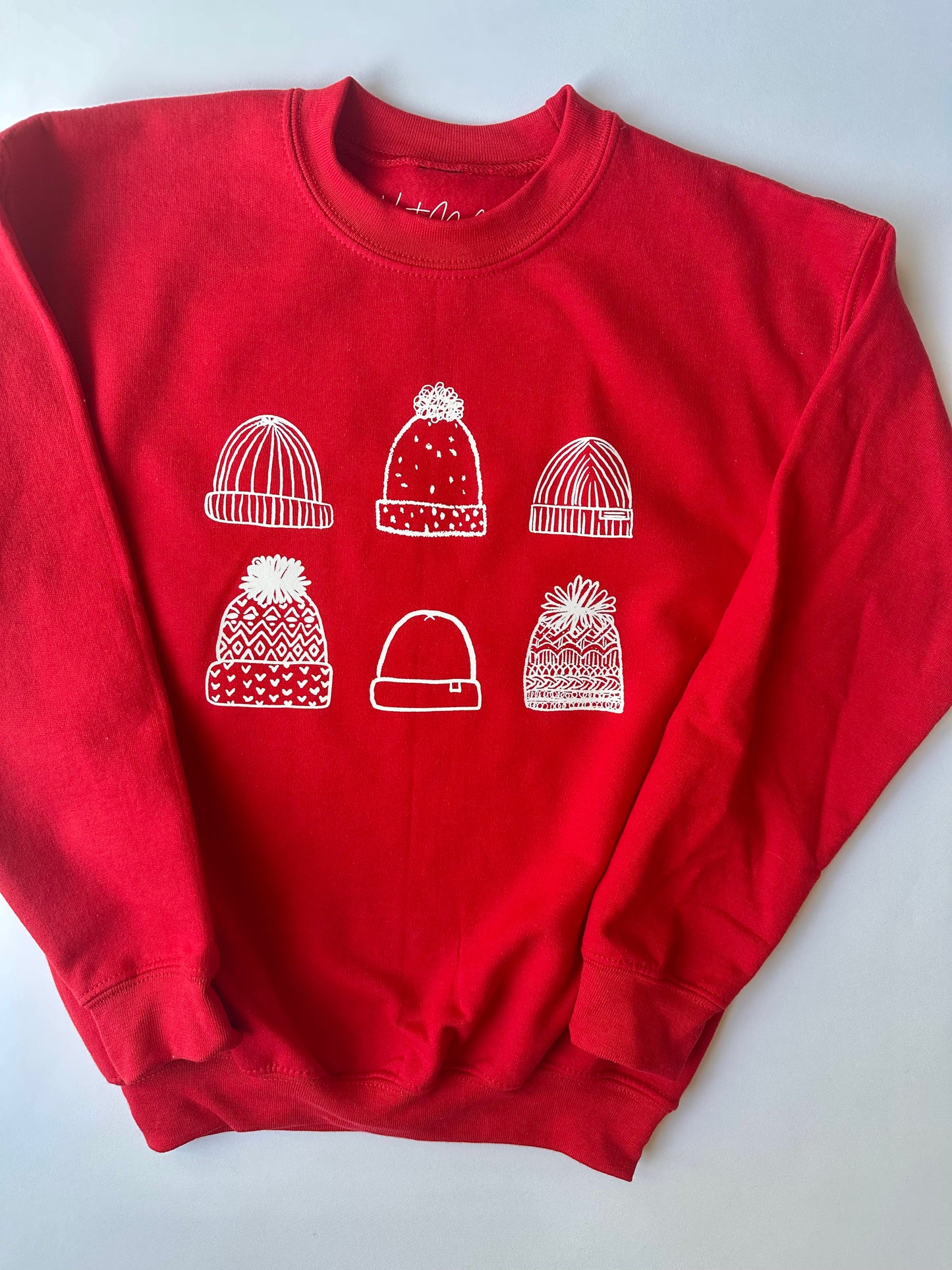 Kids Beanies on Red Sweater